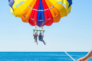 Parasailing over the Caribbean Sea in West Bay, Roatan