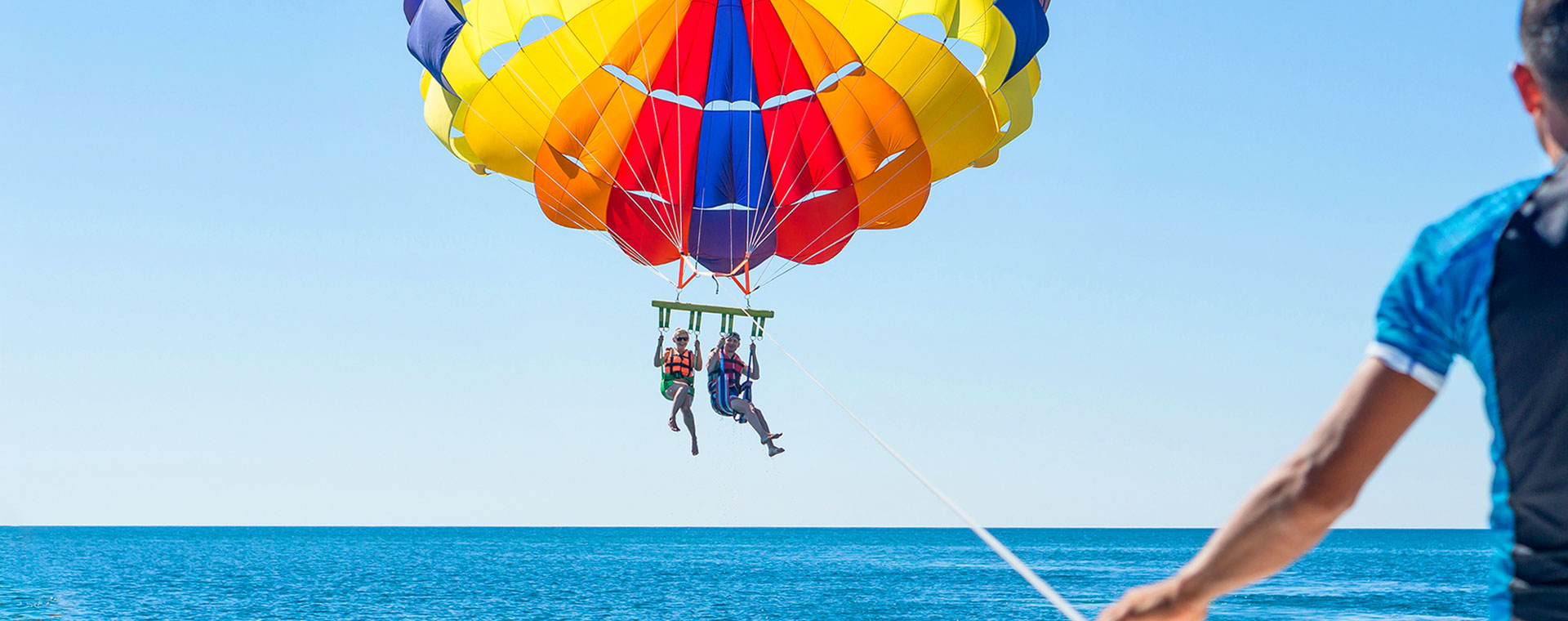 Parasailing over the Caribbean Sea in West Bay, Roatan